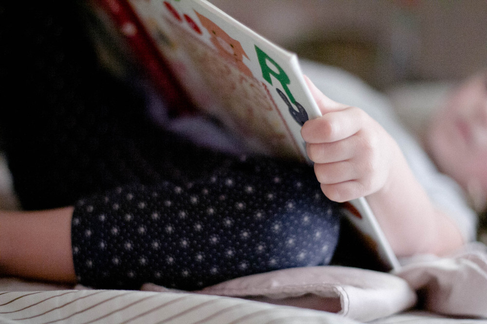 public-domain-images-free-stock-photos-little-girl-child-reading-book-bedtime-nap-11-1000x666